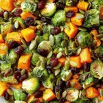 Roasted Brussels Sprouts Salad with Maple Butternut Squash, Pumpkin Seeds, and Cranberries